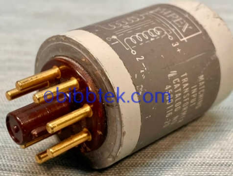 Picture of Ampex 4580116-20 Octal plug in Transformer, grey case with gold pins.